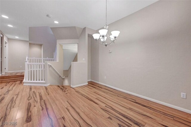 7856 Carysford Ave, Las Vegas, NV 89178 - spare room featuring wood finished floors, a chandelier, recessed lighting, and a smoke detector