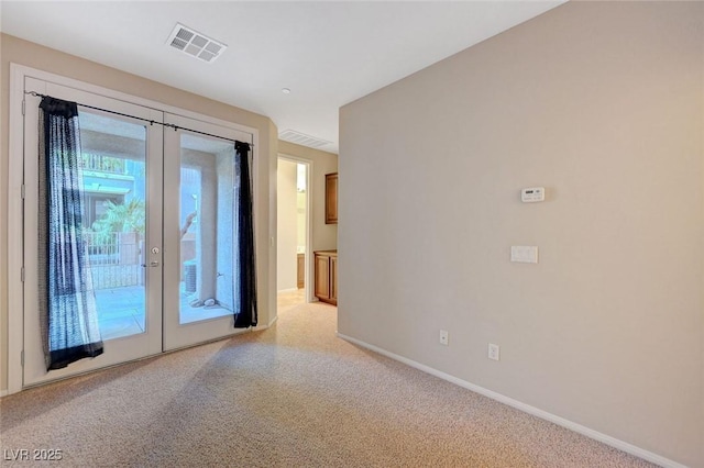 7856 Carysford Ave, Las Vegas, NV 89178 - unfurnished room featuring french doors and light carpet