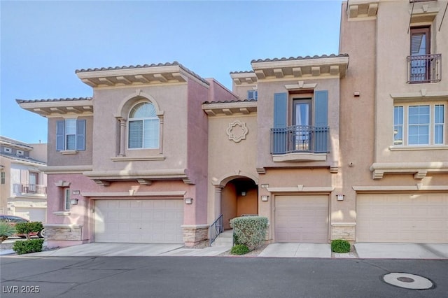 7856 Carysford Ave, Las Vegas, NV 89178 - view of front of home with an attached garage, stucco siding, and stone siding