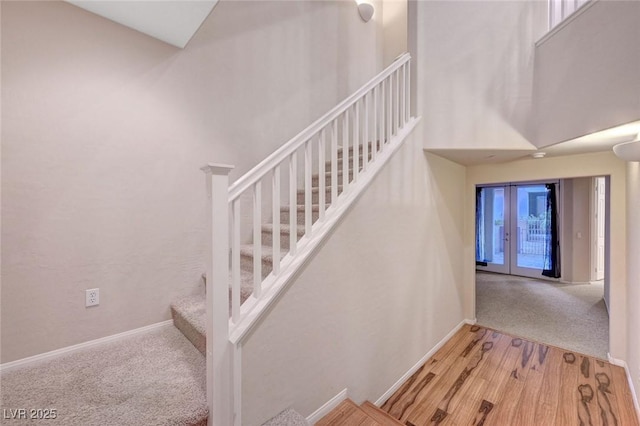 7856 Carysford Ave, Las Vegas, NV 89178 - stairway featuring carpet flooring and a high ceiling
