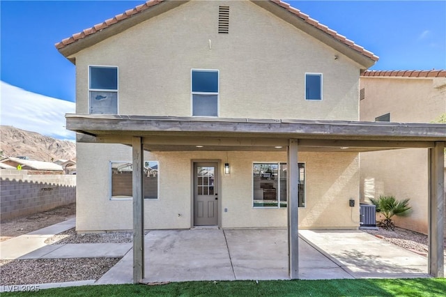 6420 Rosemount Ave, Las Vegas, NV 89156 - back of property featuring a tiled roof, a patio, and stucco siding
