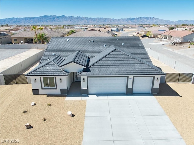 6621 S Parkwood Ct, Pahrump, NV 89061 - ranch-style home with a residential view, a garage, stucco siding, and a mountain view