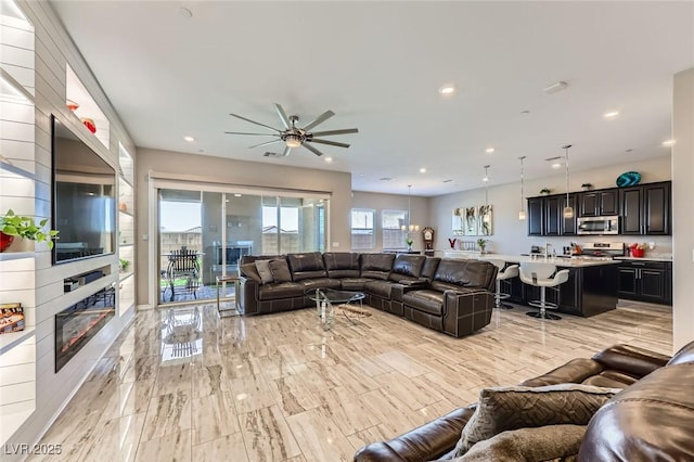 800 Rosewater Dr, Henderson, NV 89011 - living area featuring a ceiling fan, a fireplace, and recessed lighting