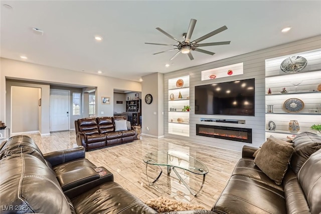 800 Rosewater Dr, Henderson, NV 89011 - living room featuring a ceiling fan, recessed lighting, a large fireplace, and wood finished floors