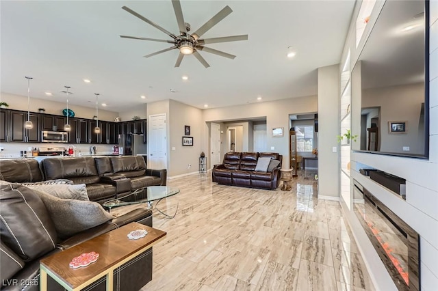 800 Rosewater Dr, Henderson, NV 89011 - living room with ceiling fan, recessed lighting, and a glass covered fireplace