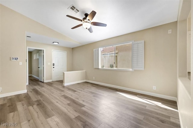 6035 Shadow Oak Dr, North Las Vegas, NV 89031 - spare room featuring a ceiling fan, lofted ceiling, and wood finished floors