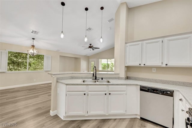 6035 Shadow Oak Dr, North Las Vegas, NV 89031 - kitchen featuring dishwashing machine, white cabinetry, light countertops, a peninsula, and light wood finished floors