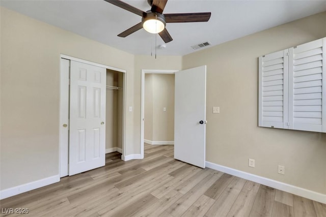 6035 Shadow Oak Dr, North Las Vegas, NV 89031 - unfurnished bedroom with light wood-style floors, a closet, and a ceiling fan