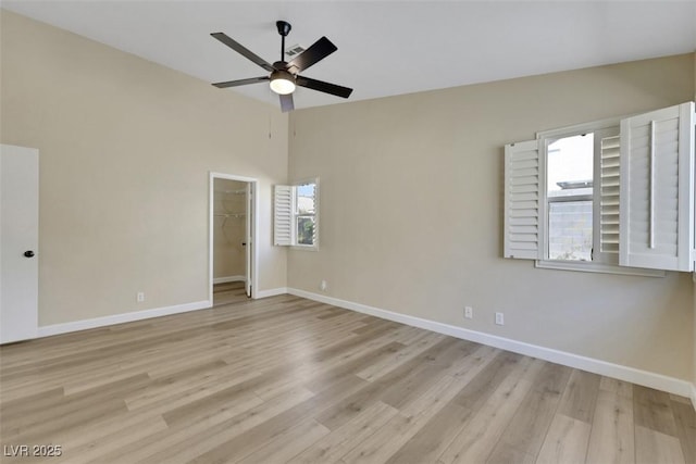 6035 Shadow Oak Dr, North Las Vegas, NV 89031 - empty room featuring light wood-style floors, a ceiling fan, and vaulted ceiling