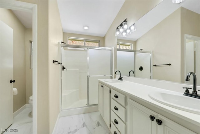 6035 Shadow Oak Dr, North Las Vegas, NV 89031 - full bath with a shower stall, marble look tiles, and double vanity