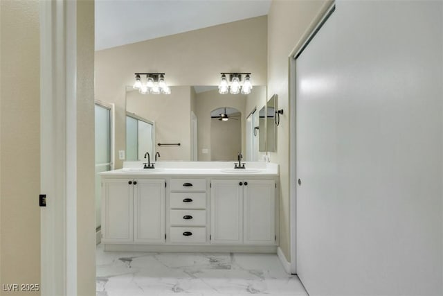 6035 Shadow Oak Dr, North Las Vegas, NV 89031 - bathroom with marble finish flooring, a ceiling fan, double vanity, and an enclosed shower