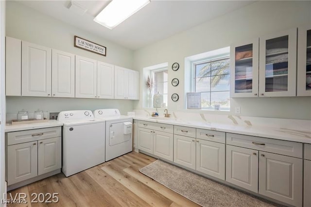 764 Ricota Ct, Henderson, NV 89012 - washroom featuring cabinet space, separate washer and dryer, and light wood-style floors