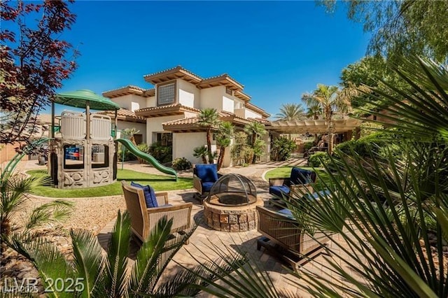 764 Ricota Ct, Henderson, NV 89012 - view of patio featuring an outdoor fire pit and a pergola