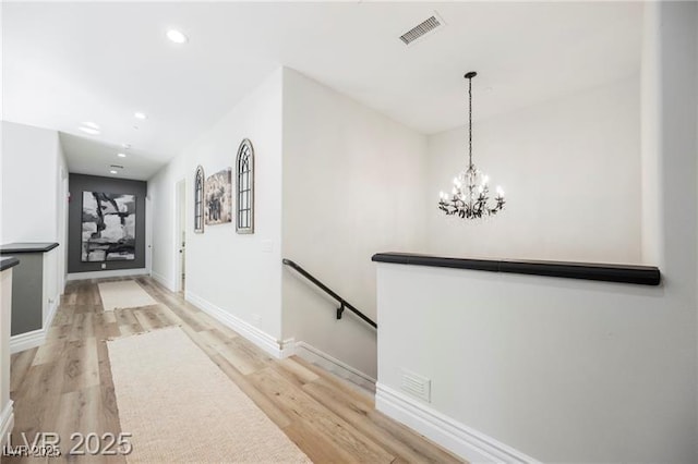 764 Ricota Ct, Henderson, NV 89012 - hall featuring an upstairs landing, light wood-type flooring, recessed lighting, and a chandelier