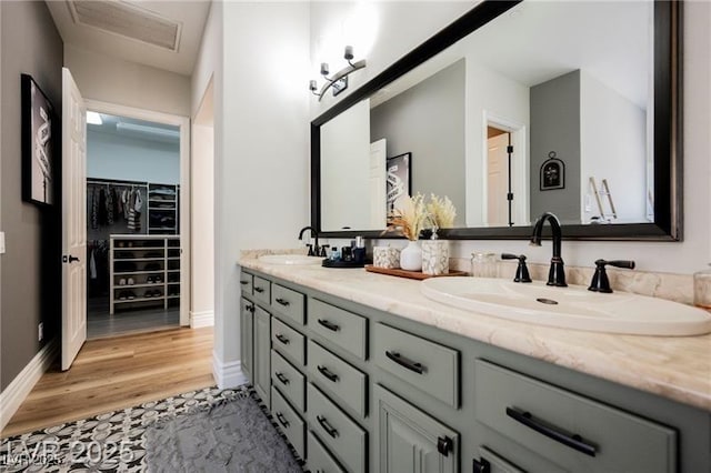 764 Ricota Ct, Henderson, NV 89012 - bathroom featuring double vanity, wood finished floors, and a spacious closet
