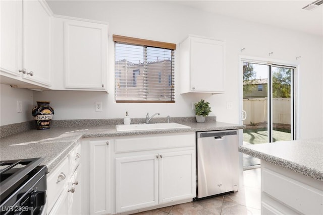 908 Shining Rose Pl, Henderson, NV 89052 - kitchen with dishwasher, range, white cabinets, light countertops, and light tile patterned floors