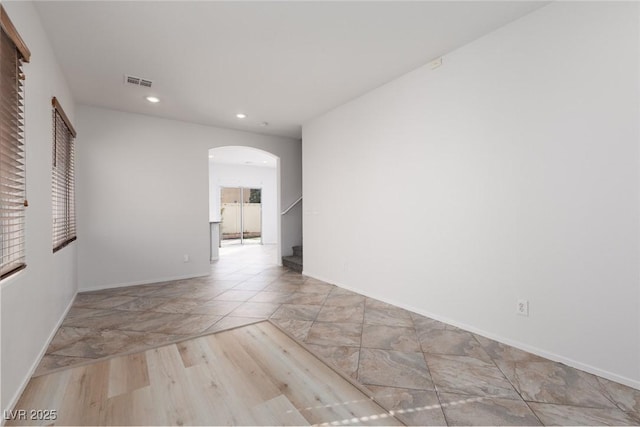 908 Shining Rose Pl, Henderson, NV 89052 - unfurnished room featuring arched walkways, recessed lighting, and stairs
