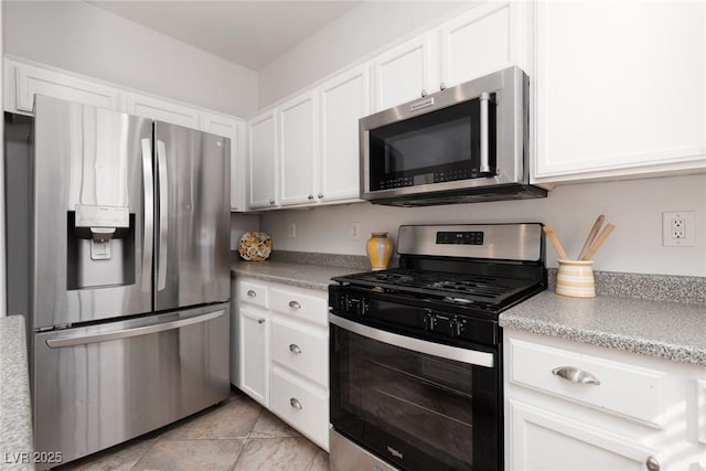 908 Shining Rose Pl, Henderson, NV 89052 - kitchen featuring stainless steel appliances, white cabinetry, light countertops, and light tile patterned floors