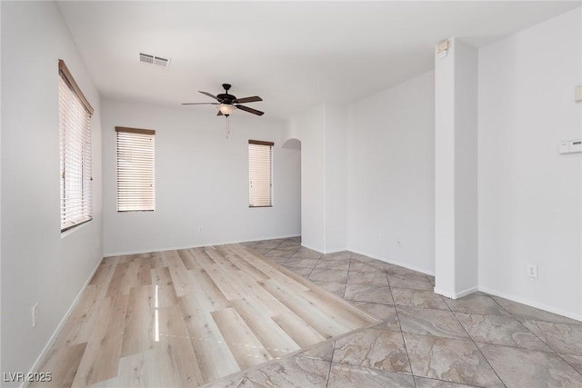 908 Shining Rose Pl, Henderson, NV 89052 - empty room featuring a ceiling fan and arched walkways