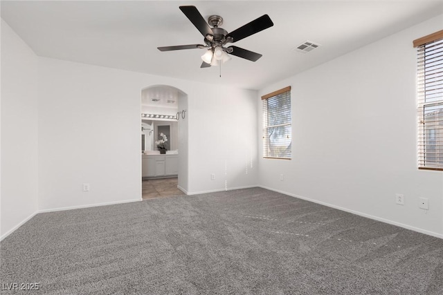 908 Shining Rose Pl, Henderson, NV 89052 - spare room with arched walkways, carpet floors, and a ceiling fan