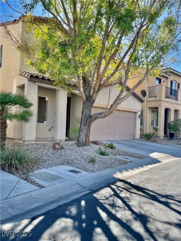 908 Shining Rose Pl, Henderson, NV 89052 - view of front facade with stucco siding, concrete driveway, and a tiled roof