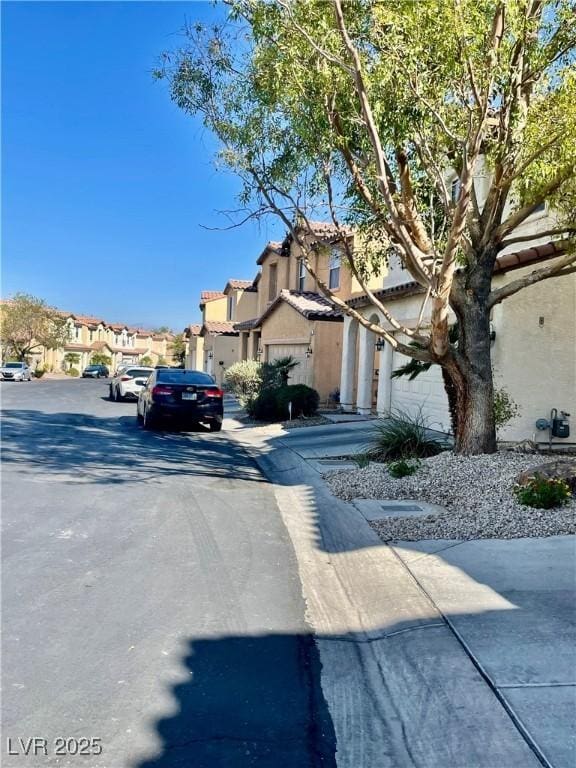 908 Shining Rose Pl, Henderson, NV 89052 - view of asphalt road with a residential view
