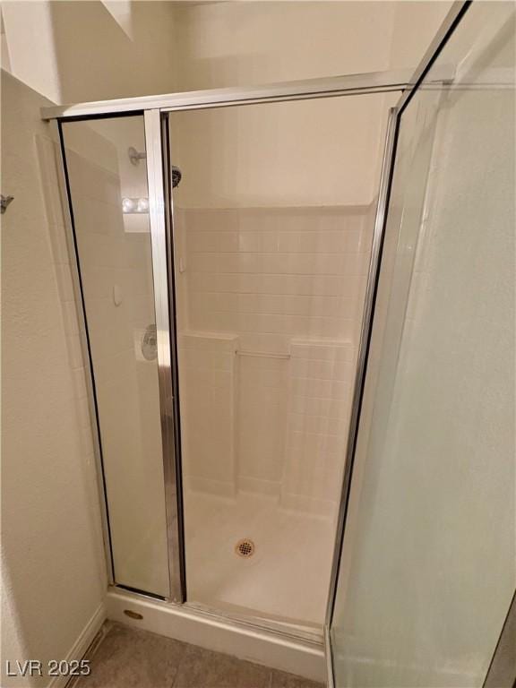 5751 E Hacienda Ave Unit 226, Las Vegas, NV 89122 - bathroom with a shower stall and tile patterned floors