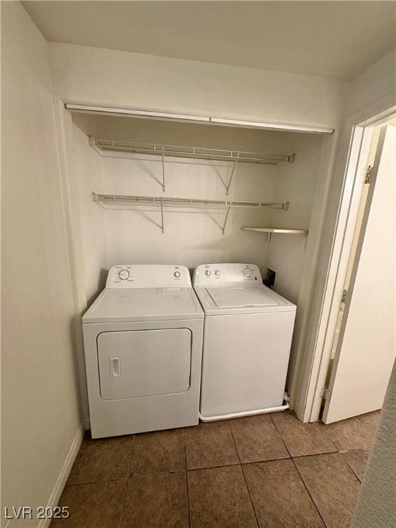 5751 E Hacienda Ave Unit 226, Las Vegas, NV 89122 - laundry area featuring independent washer and dryer and dark tile patterned floors