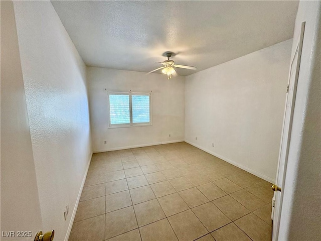 5751 E Hacienda Ave Unit 226, Las Vegas, NV 89122 - unfurnished room with a ceiling fan, light tile patterned flooring, and a textured ceiling
