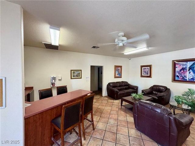 5751 E Hacienda Ave Unit 226, Las Vegas, NV 89122 - living room with ceiling fan and light tile patterned floors