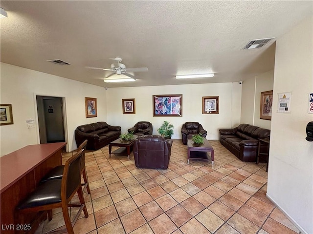 5751 E Hacienda Ave Unit 226, Las Vegas, NV 89122 - living area with a textured ceiling and a ceiling fan