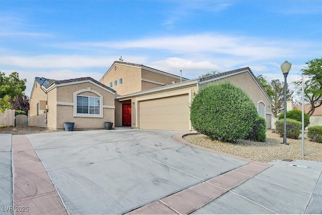 4708 Cohiba Way N, Las Vegas, NV 89031 - view of front of home with stucco siding, driveway, and an attached garage