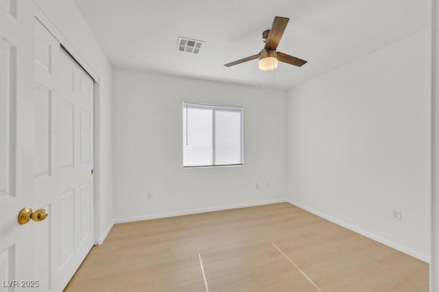 4708 Cohiba Way N, Las Vegas, NV 89031 - unfurnished bedroom featuring light wood finished floors, a closet, and a ceiling fan