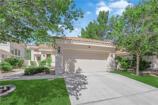 7837 Sea Rock Rd, Las Vegas, NV 89128 - mediterranean / spanish home featuring a tile roof, stucco siding, driveway, and a garage