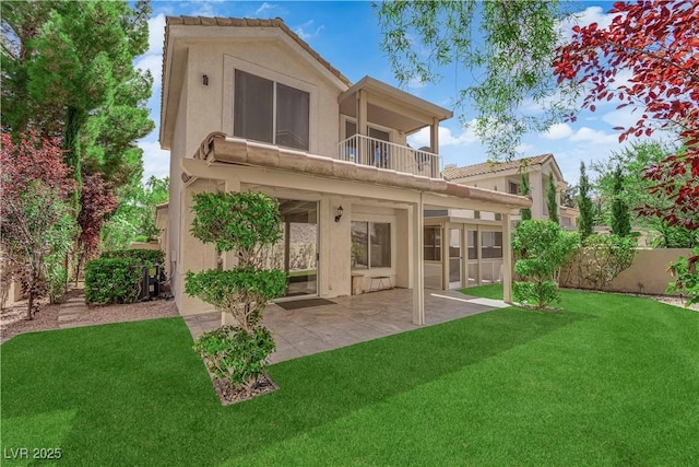 7837 Sea Rock Rd, Las Vegas, NV 89128 - rear view of property featuring a balcony, a patio area, and stucco siding