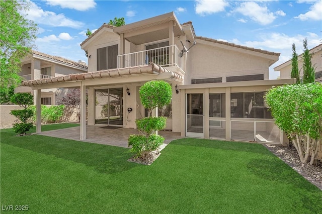 7837 Sea Rock Rd, Las Vegas, NV 89128 - back of house with a patio, stucco siding, a yard, a balcony, and a sunroom