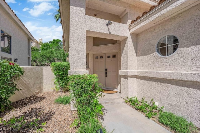 7837 Sea Rock Rd, Las Vegas, NV 89128 - view of exterior entry featuring stucco siding