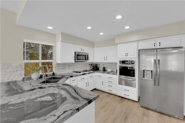 7837 Sea Rock Rd, Las Vegas, NV 89128 - kitchen featuring stainless steel appliances, a warming drawer, stone countertops, backsplash, and recessed lighting