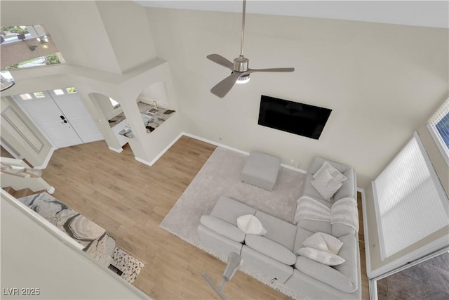 7837 Sea Rock Rd, Las Vegas, NV 89128 - living area featuring a towering ceiling, wood finished floors, and ceiling fan