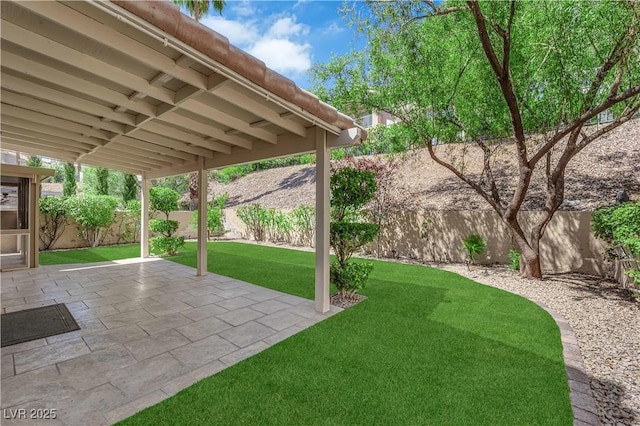 7837 Sea Rock Rd, Las Vegas, NV 89128 - fenced backyard with a patio area