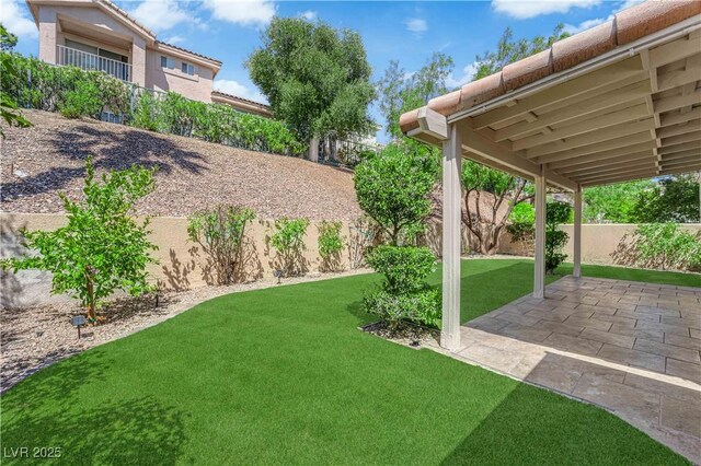 7837 Sea Rock Rd, Las Vegas, NV 89128 - fenced backyard with a patio