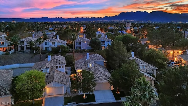 7837 Sea Rock Rd, Las Vegas, NV 89128 - aerial overview of property's location featuring a mountainous background and nearby suburban area