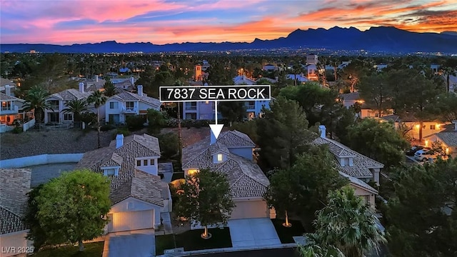 7837 Sea Rock Rd, Las Vegas, NV 89128 - aerial view at dusk of a mountain view and a residential view