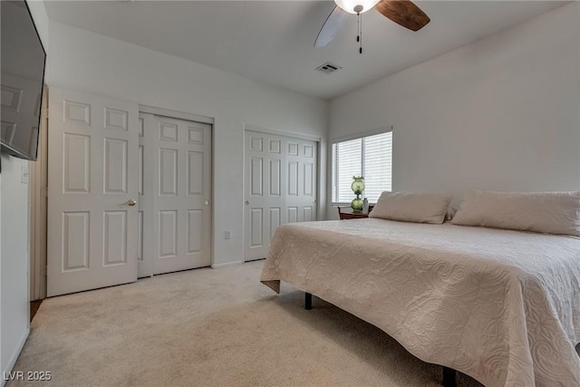 3936 Pepper Thorn Ave Unit 3, North Las Vegas, NV 89081 - bedroom with two closets, light carpet, and ceiling fan