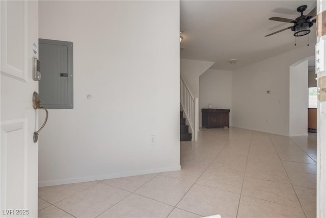 3936 Pepper Thorn Ave Unit 3, North Las Vegas, NV 89081 - unfurnished room featuring electric panel, a ceiling fan, stairway, and light tile patterned flooring