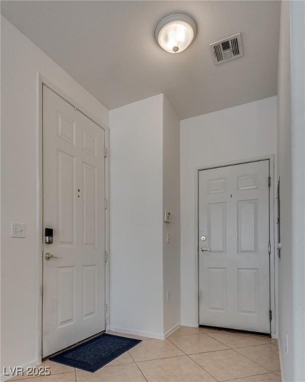 3936 Pepper Thorn Ave Unit 3, North Las Vegas, NV 89081 - entrance foyer with light tile patterned floors and baseboards