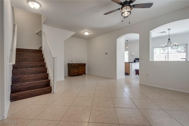 3936 Pepper Thorn Ave Unit 3, North Las Vegas, NV 89081 - spare room featuring a ceiling fan, light tile patterned floors, arched walkways, stairs, and a chandelier