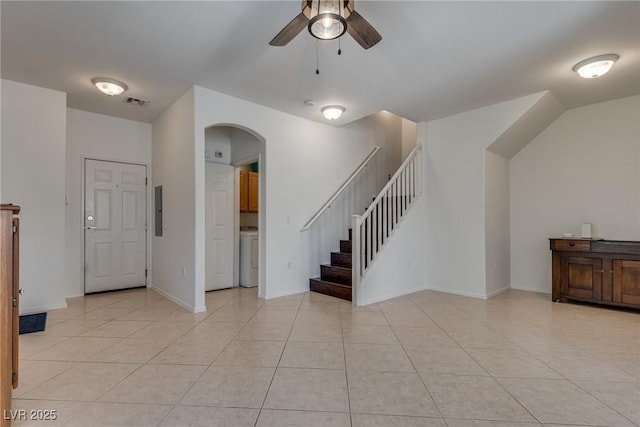 3936 Pepper Thorn Ave Unit 3, North Las Vegas, NV 89081 - unfurnished living room featuring a ceiling fan, stairs, arched walkways, electric panel, and washer / clothes dryer