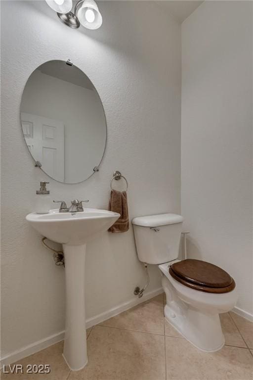 3936 Pepper Thorn Ave Unit 3, North Las Vegas, NV 89081 - half bathroom featuring tile patterned floors