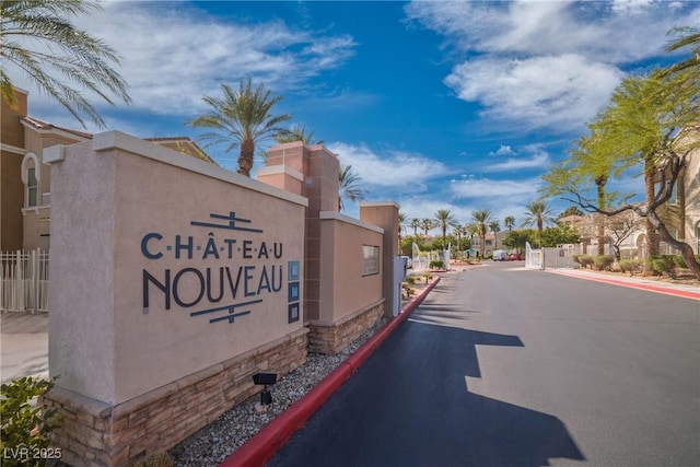 10001 Peace Way Unit 2322, Las Vegas, NV 89147 - view of asphalt street with curbs, a gated entry, a residential view, and a gate